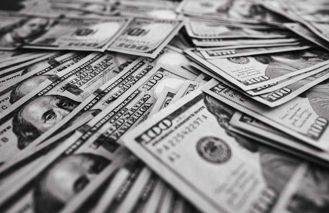 pile of $100 dollar bills